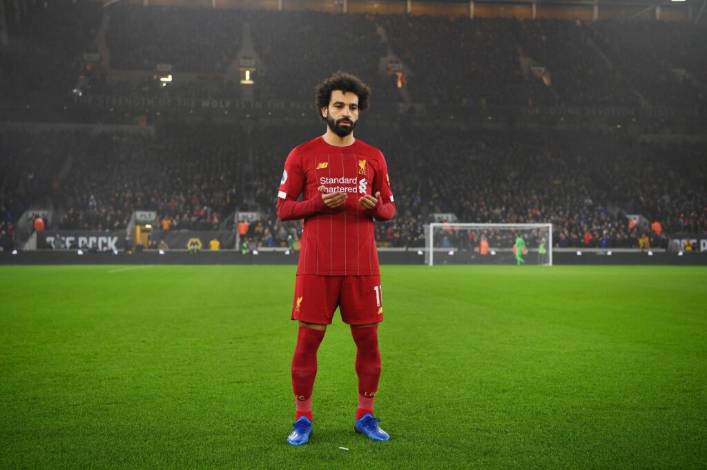 Premier League players breaking Ramadan fast during a match with referee and teammates